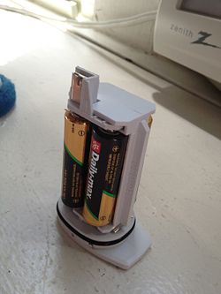 Load the holder with batteries