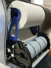 Fig 4. Open Blue Spindle Cover and Load Roll with Towel Faced Inside (cover is removed for usability ease)