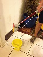 Step 6: Slide wringer towards end of mop, over the bucket